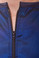 Detail of zipper on  royal blue zip front salon smock