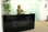 Product Code: GR 01. Reception desk made of a high quality glass finish. The black opaque glass provides high levels of privacy whilst providing an interesting and reflective vertical surface. Company name or logo can be added if required. Available in a range of sizes and finishes.