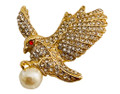 Magnificent eagle pin clutches a lustrous faux pearl, gold-plated with diamond-like rhinestones. 
