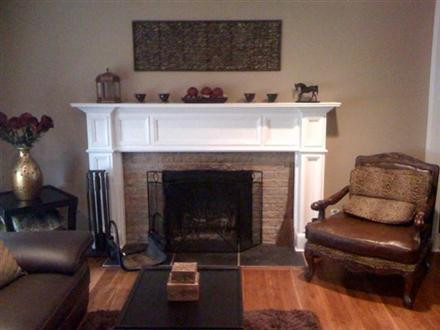 An upgraded room with the Georgetown fireplace mantel shown in a white paint grade.