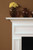 The pop out wood frames are carefully carved into the custom made fireplace mantel.