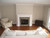 Leesburg Mantel with Stacked Stone surround