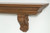 Detailed image of the acanthus leaf corbels in Red Oak, stained with our Chestnut Finish.