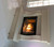 The Avant Stone mantel with raised hearth and extra facing panels