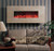 Our Honey Travertine Fireplace Facing compliments this Electric Fireplace with rich earth tones.
