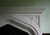 Nice geometric pattern in the spandrel of this Tudor stone mantel