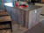 A kitchen island featured our weathered cedar paneling