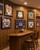 A classic, upscale home bar and sports lounge that perfectly captures a comfortable, traditional clubroom feel. Designed as an inviting entertainment hub, the space leverages full-wall Spirit Birch wood paneling to create a warm, cozy, and sophisticated atmosphere for relaxing or watching a game.